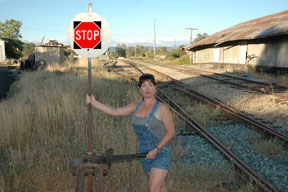 Stacie hold Stop sign, advocating for no more unnecessary Wilderness
